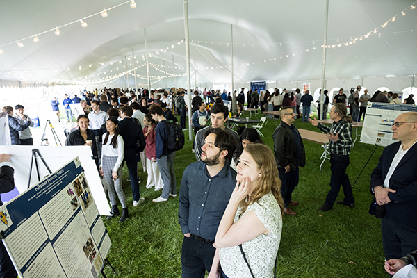 Students showcasing their work during a poster session.