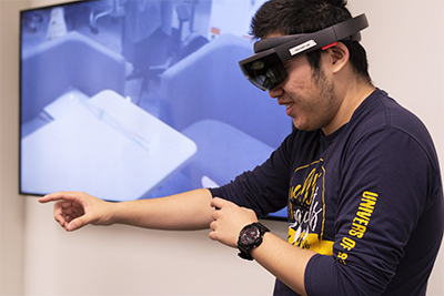 Sifan Ye '20 tests an Augmented Reality field in Prof. Bai's AR/VR Lab