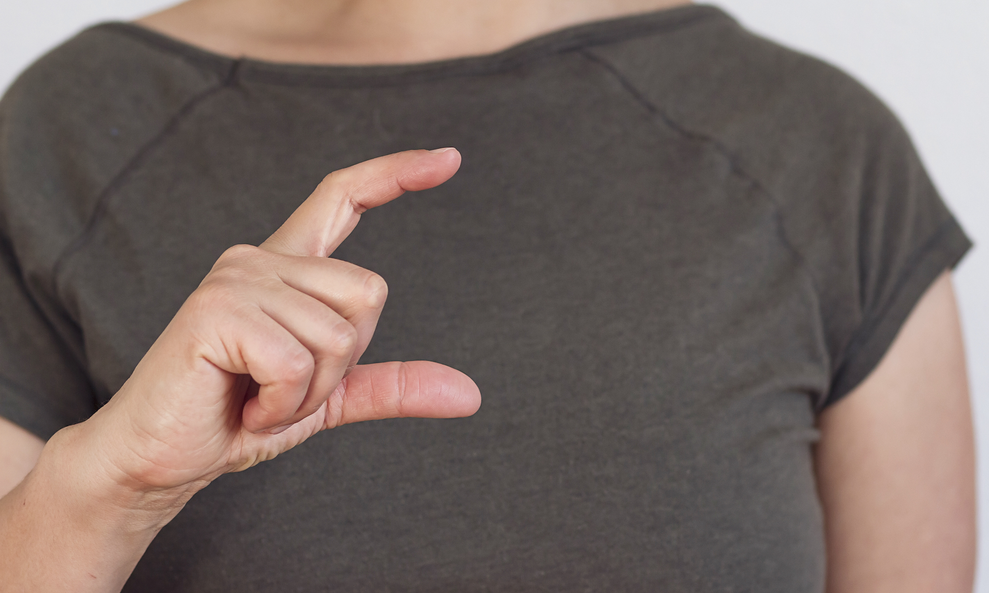 Patient hand making gesture for disease development